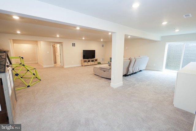 basement with recessed lighting, light carpet, and baseboards