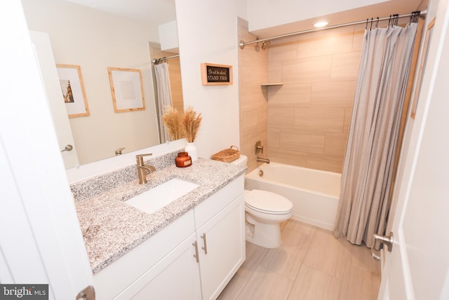 bathroom with vanity, toilet, and shower / tub combo