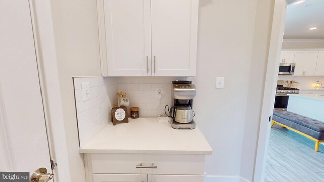mudroom with wood finished floors