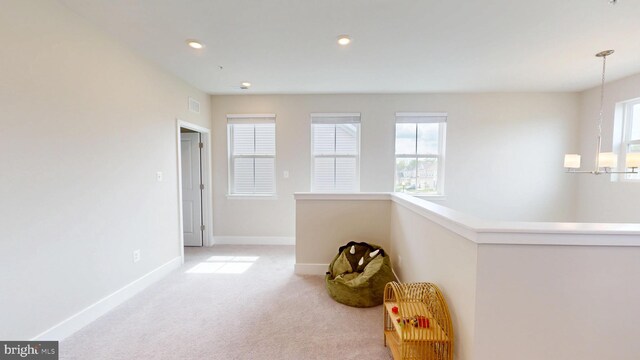 playroom with baseboards, light colored carpet, recessed lighting, and a chandelier