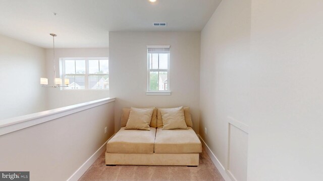 sitting room with baseboards and carpet flooring