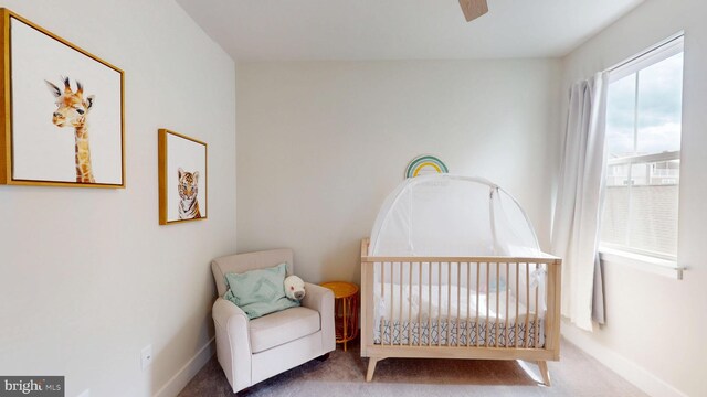 carpeted bedroom featuring baseboards and ceiling fan