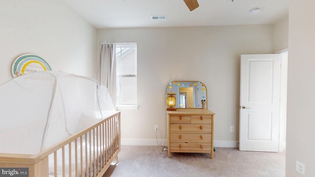 carpeted bedroom featuring baseboards and ceiling fan