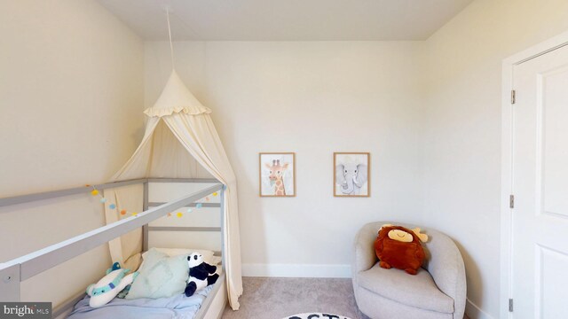 carpeted bedroom with baseboards