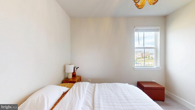 carpeted bedroom with baseboards