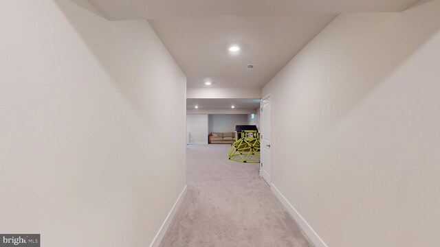 hall with light colored carpet, recessed lighting, and baseboards