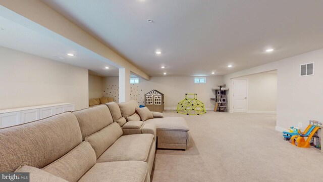 carpeted living area with recessed lighting and baseboards