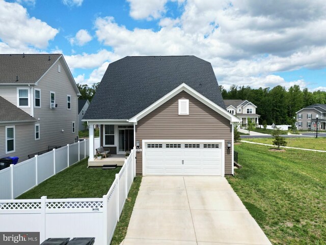 view of front of house with driveway, a shingled roof, and covered porch