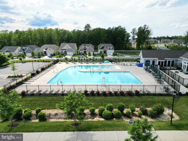 community pool featuring a residential view