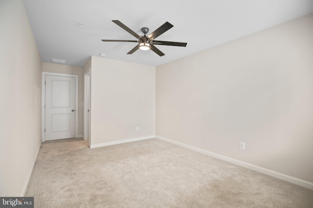 1398 Rail Stop Dr, Woodbridge, VA 22191 - unfurnished room with light carpet, a ceiling fan, and baseboards