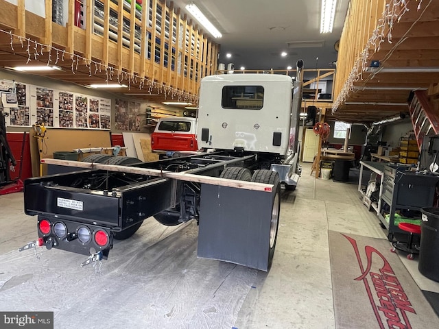 garage featuring a workshop area and a garage door opener