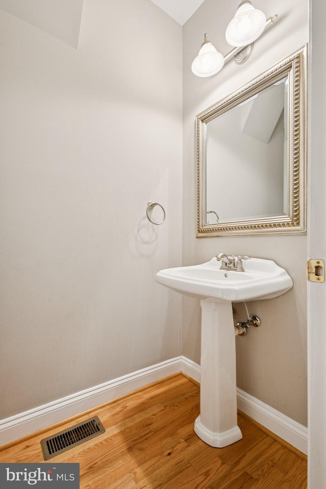 301 Gentle Breeze Cir, Fredericksburg, VA 22406 - bathroom featuring baseboards and wood finished floors