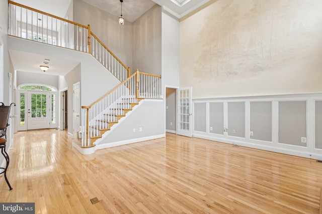 301 Gentle Breeze Cir, Fredericksburg, VA 22406 - foyer entrance featuring a high ceiling, wood finished floors, and stairway
