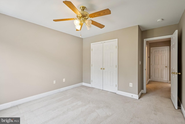 301 Gentle Breeze Cir, Fredericksburg, VA 22406 - unfurnished bedroom with light carpet, a closet, and a ceiling fan