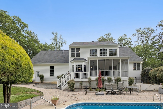 301 Gentle Breeze Cir, Fredericksburg, VA 22406 - rear view of property with a sunroom, a patio area, an outdoor pool, and roof with shingles