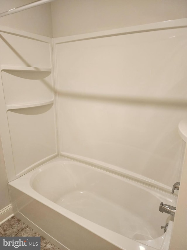 full bath with tile patterned floors and  shower combination
