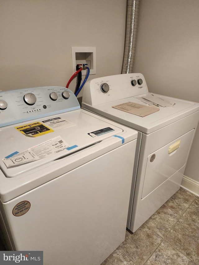 laundry room featuring separate washer and dryer