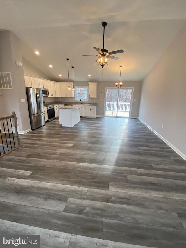unfurnished living room featuring visible vents, baseboards, ceiling fan, and dark wood-style floors