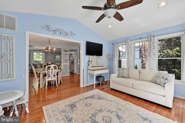 7707 W Dr, Glen Burnie, MD 21060 - living area featuring lofted ceiling, a chandelier, a ceiling fan, wood finished floors, and recessed lighting
