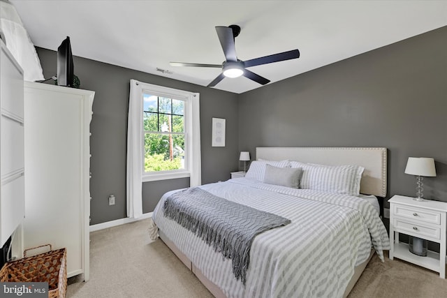 7707 W Dr, Glen Burnie, MD 21060 - bedroom with light carpet, baseboards, and a ceiling fan