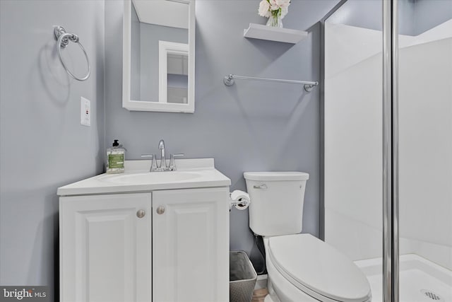 7707 W Dr, Glen Burnie, MD 21060 - bathroom with a shower stall, vanity, and toilet