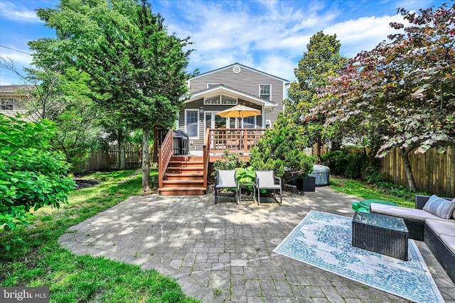7707 W Dr, Glen Burnie, MD 21060 - back of house featuring a deck, a patio area, a fenced backyard, outdoor lounge area, and stairway