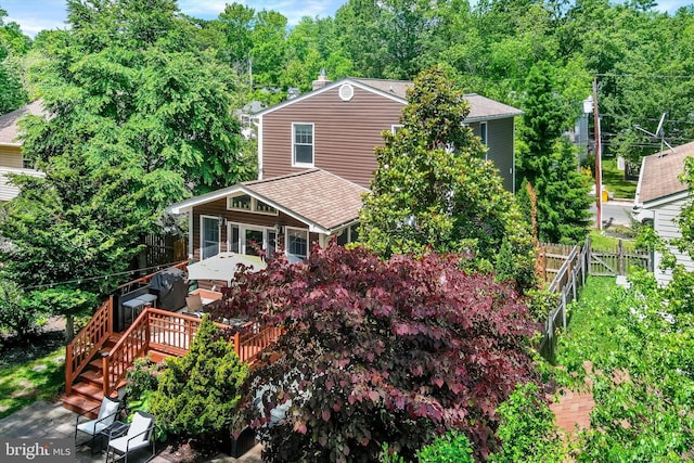 7707 W Dr, Glen Burnie, MD 21060 - view of front of home with a fenced backyard, roof with shingles, and a deck