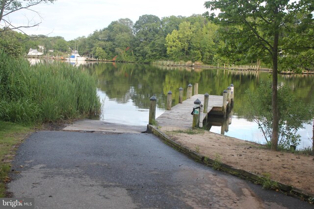 7707 W Dr, Glen Burnie, MD 21060 - dock area with a water view and a wooded view