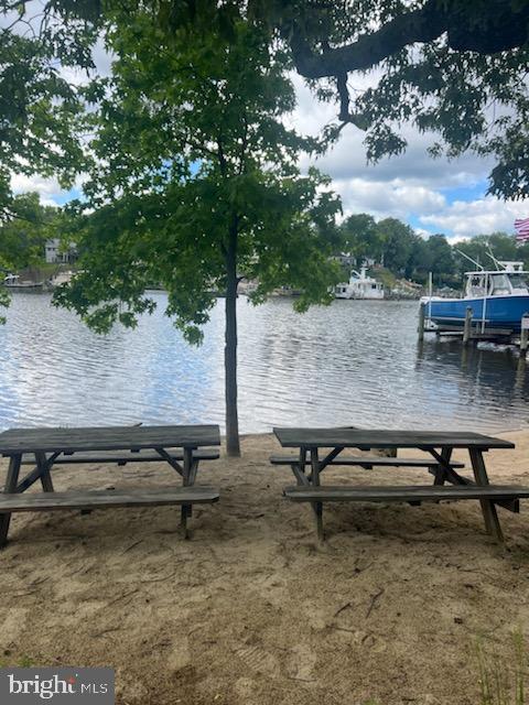 7707 W Dr, Glen Burnie, MD 21060 - view of property's community featuring a water view and a dock