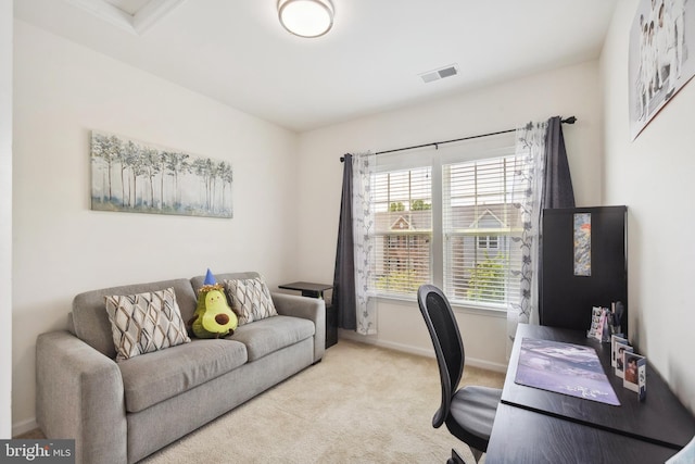 carpeted home office with baseboards and visible vents