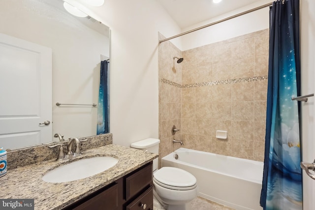 bathroom featuring vanity, shower / bath combo, toilet, and visible vents