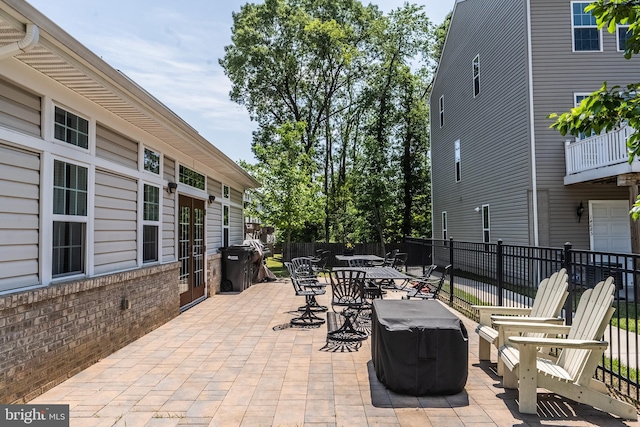view of patio featuring fence