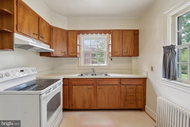 kitchen featuring open shelves, electric range, radiator, under cabinet range hood, and a sink