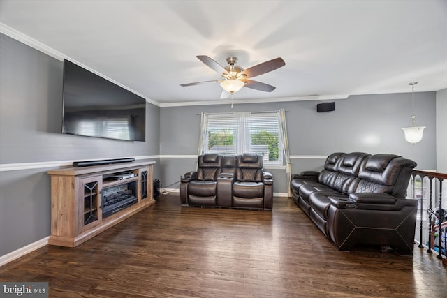 living room with crown molding, ceiling fan, dark wood-style floors, and baseboards
