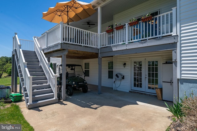 rear view of property with stairway, french doors, and an attached carport