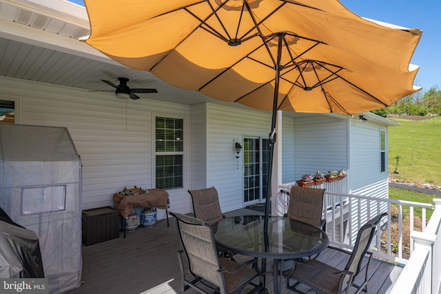 deck with a ceiling fan, outdoor dining space, and visible vents