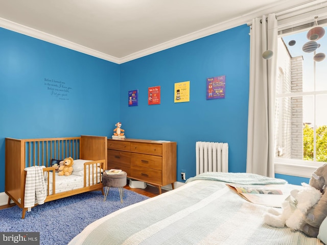 bedroom with radiator heating unit and ornamental molding