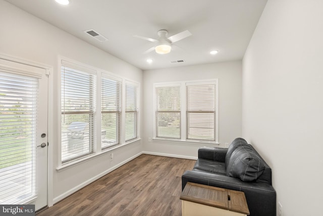 sitting room with a healthy amount of sunlight, a ceiling fan, and visible vents