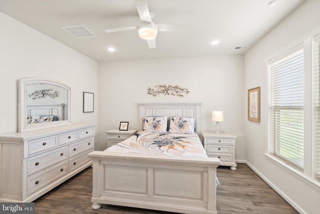 bedroom with visible vents, recessed lighting, and dark wood-style floors