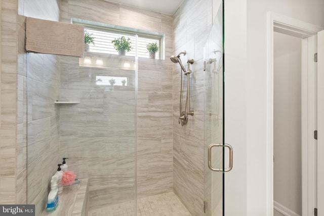 full bath featuring a shower stall