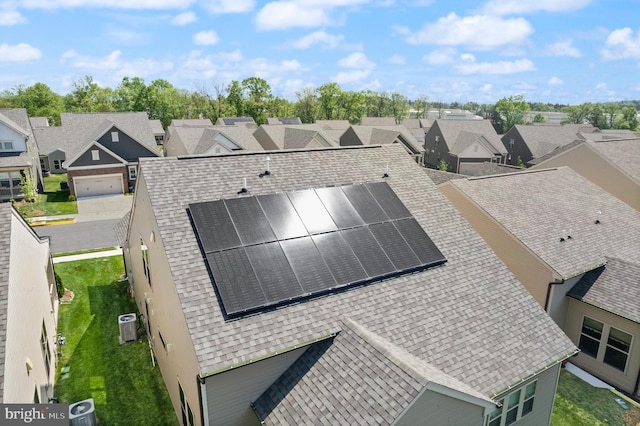 birds eye view of property with a residential view