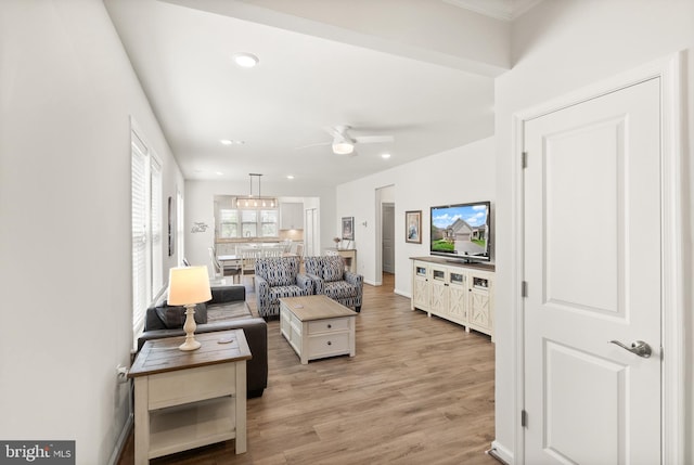living area with recessed lighting, ceiling fan, and light wood-type flooring