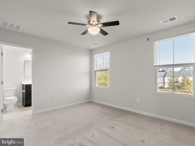 unfurnished bedroom with light carpet and visible vents