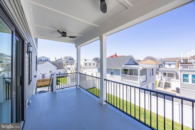 balcony with a ceiling fan and a residential view