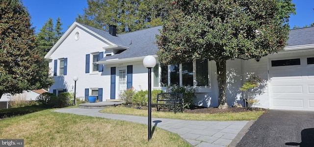 12405 Ellen Ct, Silver Spring, MD 20904 - view of front facade featuring a front yard, a chimney, brick siding, and a shingled roof
