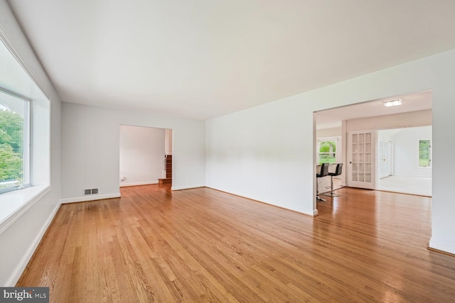 12405 Ellen Ct, Silver Spring, MD 20904 - empty room featuring light wood-style flooring, healthy amount of natural light, and baseboards