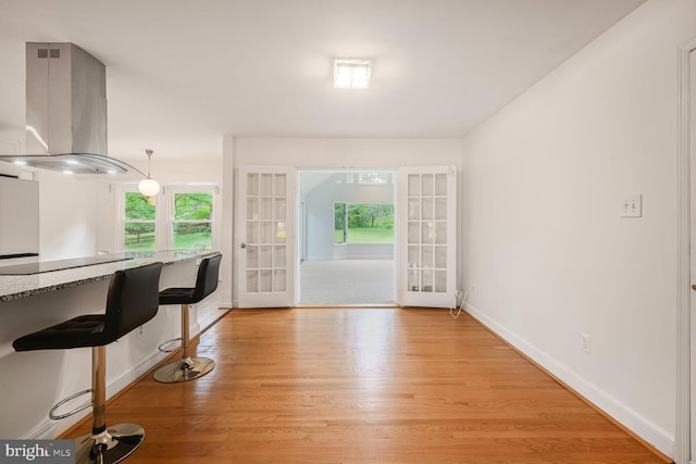 12405 Ellen Ct, Silver Spring, MD 20904 - dining area with french doors, light wood-style flooring, and baseboards