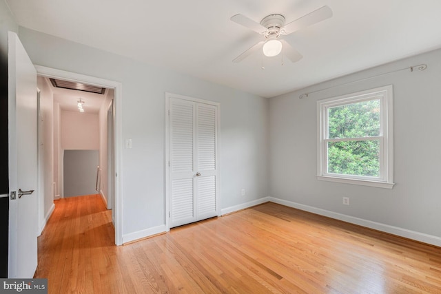 12405 Ellen Ct, Silver Spring, MD 20904 - unfurnished bedroom featuring light wood-style floors, a closet, baseboards, and attic access