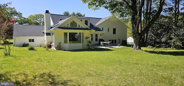 12405 Ellen Ct, Silver Spring, MD 20904 - back of house with a chimney, a yard, and a patio area