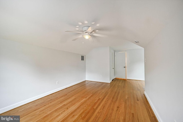 12405 Ellen Ct, Silver Spring, MD 20904 - unfurnished room featuring lofted ceiling, a ceiling fan, baseboards, and light wood-style flooring